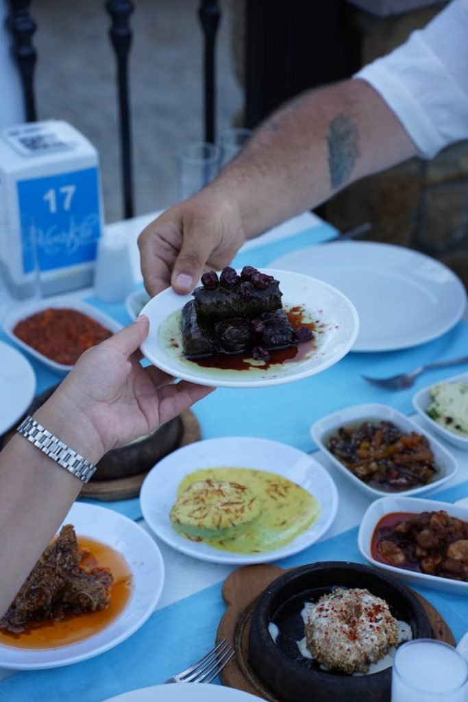 An array of delicious Turkish meze being shared outdoors in Çanakkale, Türkiye.